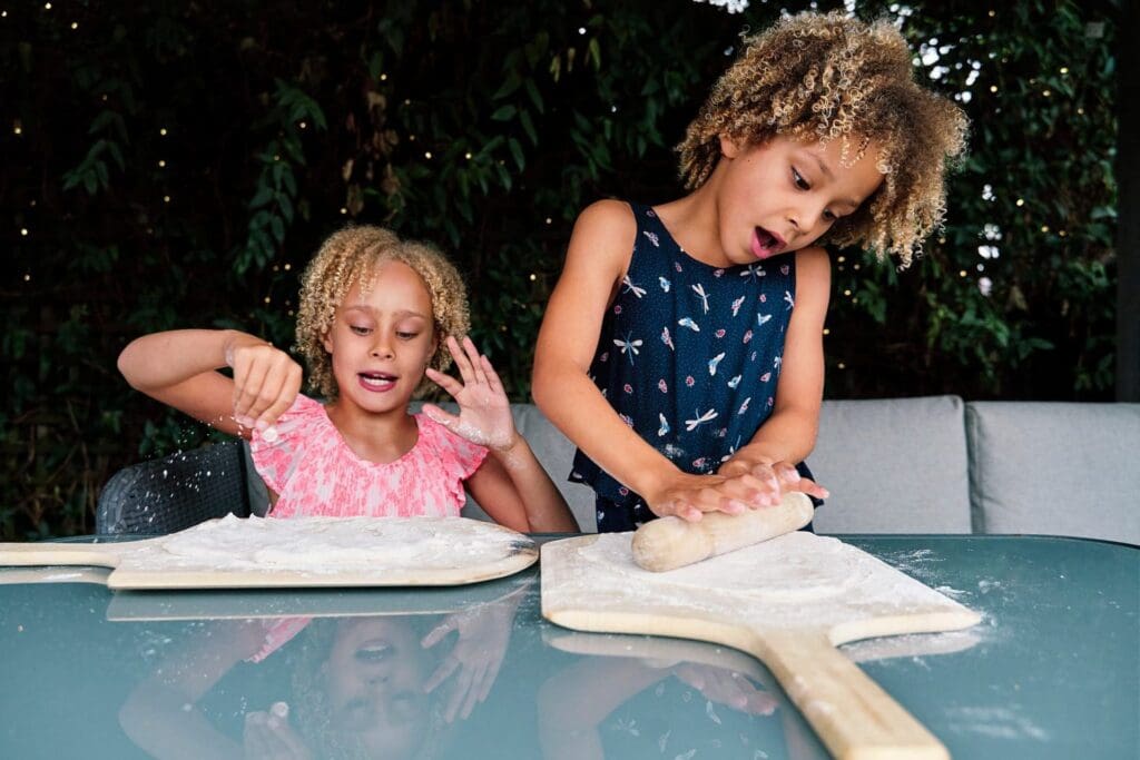 Two girls cooking during a family photography session in Hayes Bromley, South East London