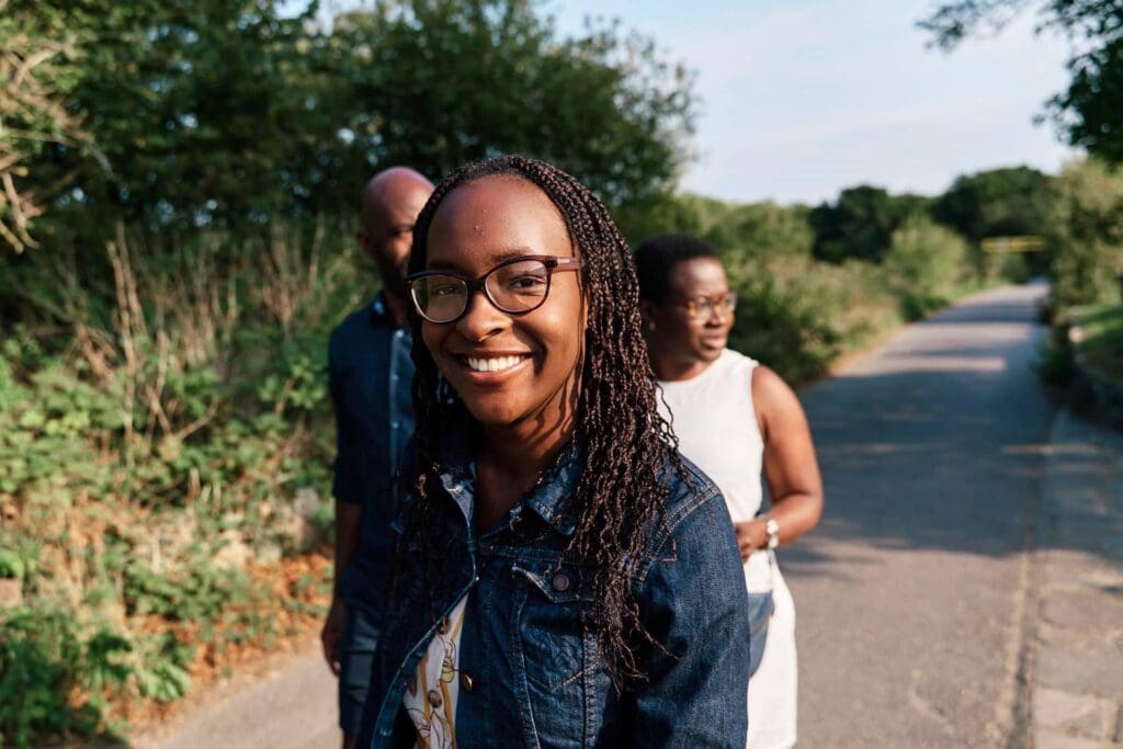 Smiling teenage girl looking at the camera during a family photography session in Bickley South-East London