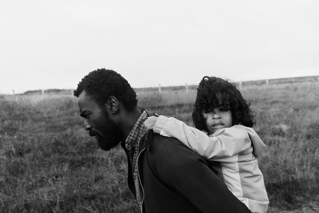 This photograph of a father carrying his son on his back during a long windy walk is one of my 5 favourite photographs of 2020.