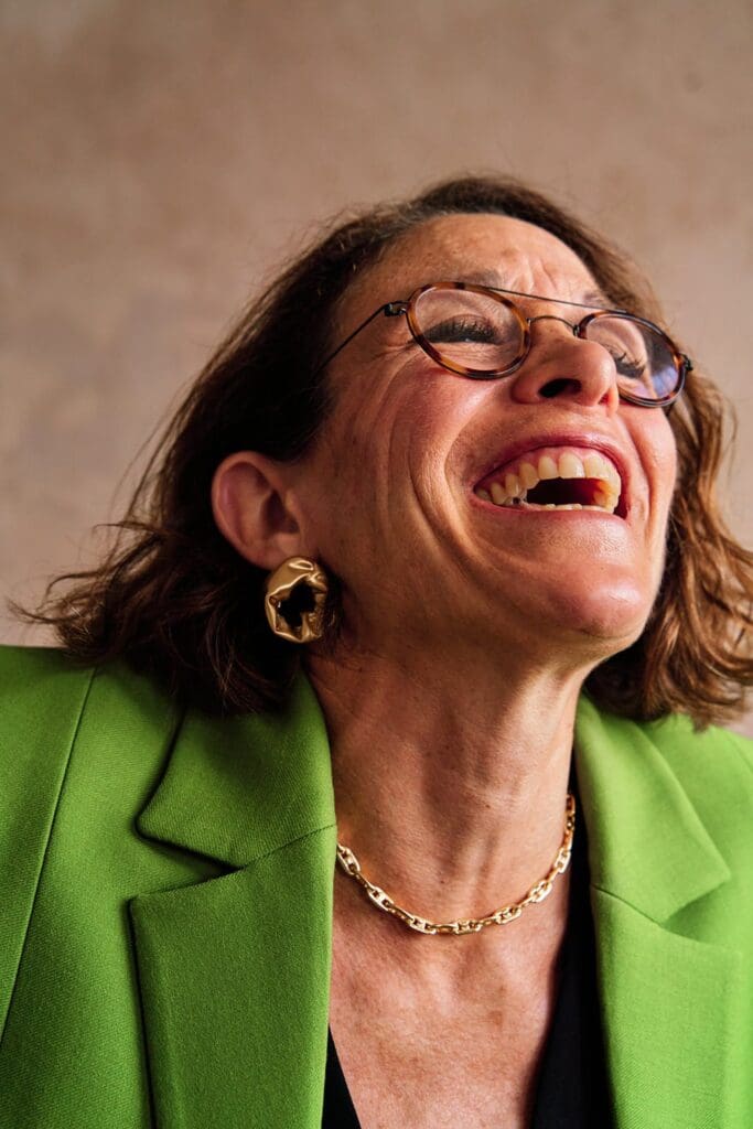 Natural branding photograph of female entrepreneur laughing authentically during London personal branding session