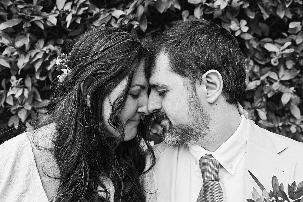 Romantic and candid couple portrait photographed at a Town Hall wedding in London during documentary wedding session