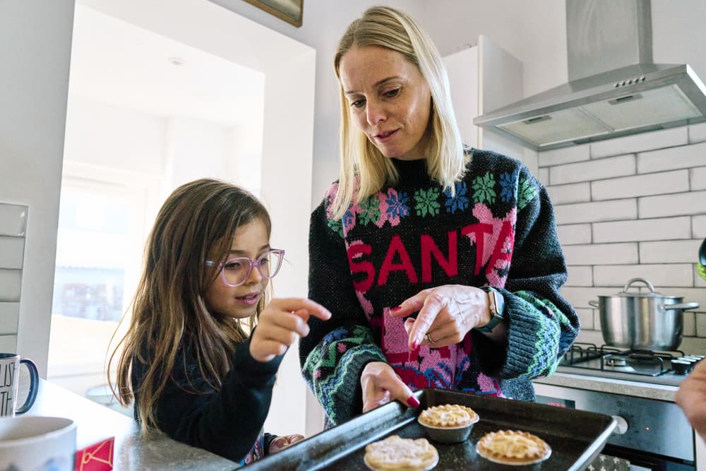 Family baking mince pies during a documentary Christmas mini session in Bromley