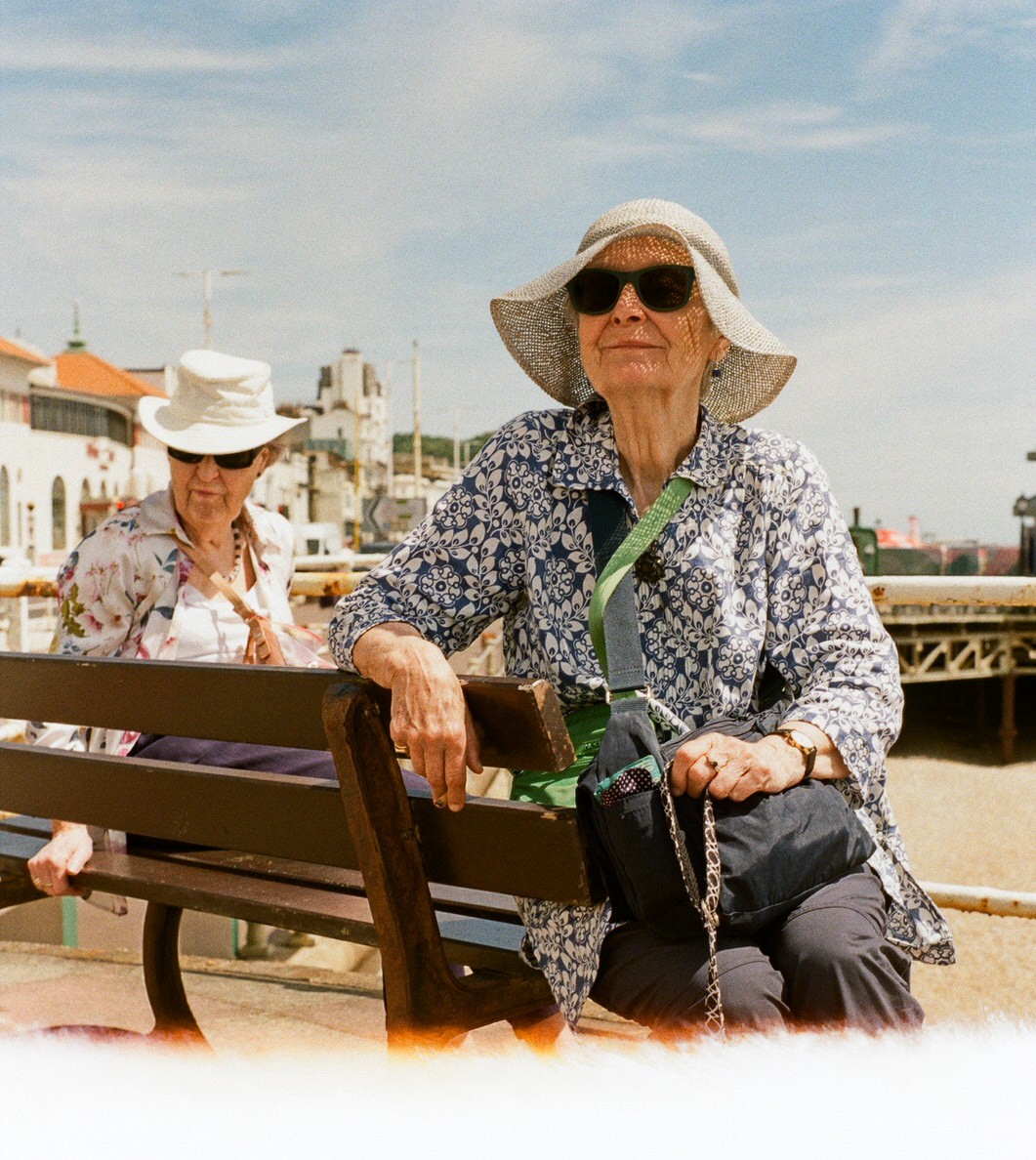 Photo of old lady on a bench taken duing a photo walk